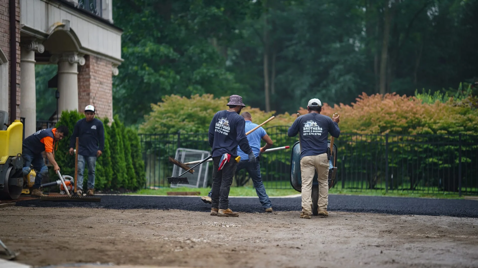 Brothers Paving crew working on estate driveway in Lloyd Harbor