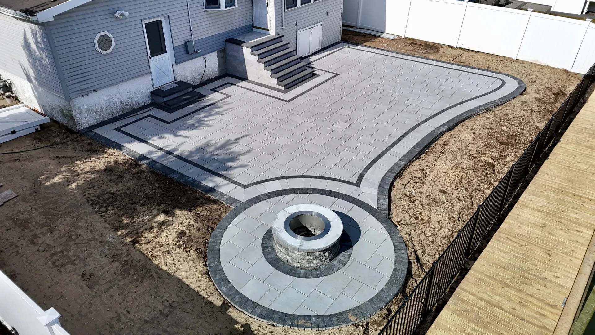 Completed backyard paver patio in Huntington