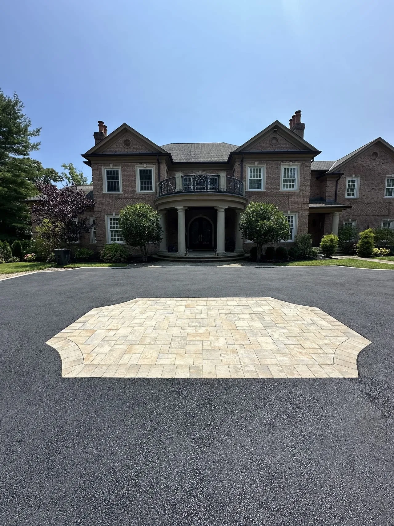 Custom paver medallion with estate mansion backdrop, Lloyd Harbor Gold Coast