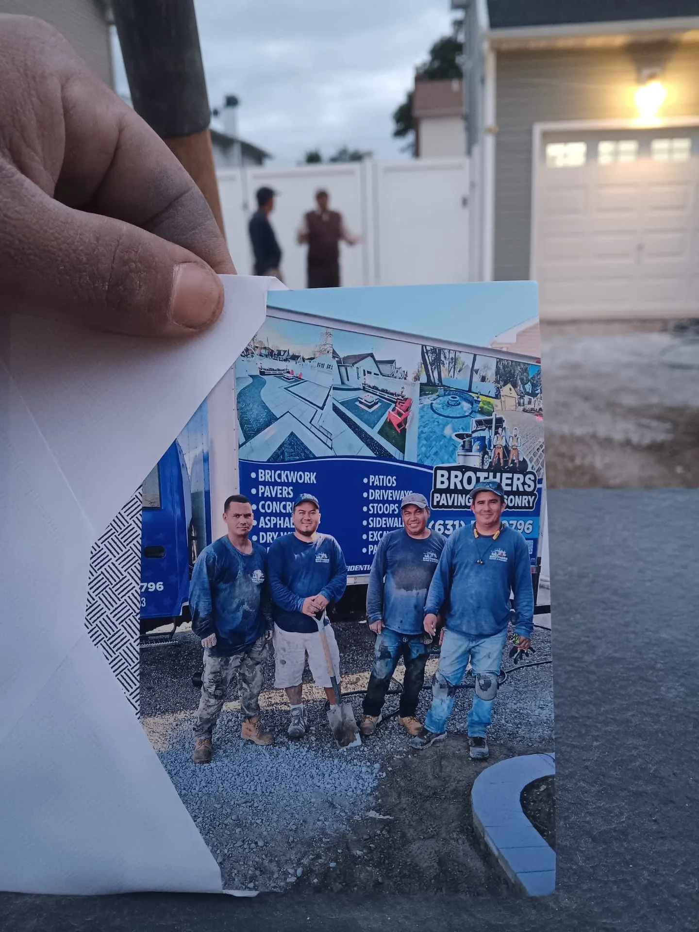 The full Brothers Paving crew standing in front of a branded truck